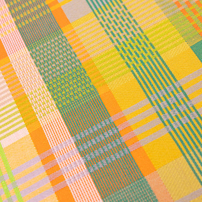 Colorful plaid pattern with green, orange, and yellow colors.