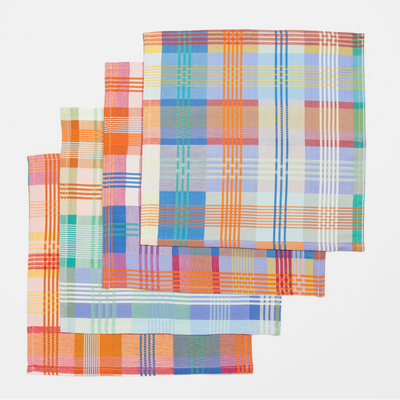 Set of colorful plaid napkins on a white background