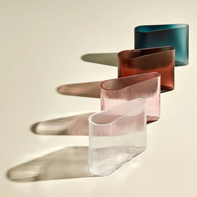multiple crystal vases from the series "mist" by Tamer Nakisci for Nude glass, 4 vases on a light creme background, well lit with a long shadow