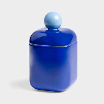 blue jar with a sphere as a handle on top of the lid, on a white background
