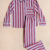 Red and white striped pajama set on a beige background