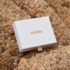 White box with 'AGAPèE' branding on a textured brown surface
