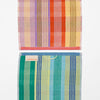 Two striped towels, one multicolored and one with green, yellow, and blue stripes, on a white background.