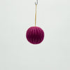 Purple ball with a hook on a white background