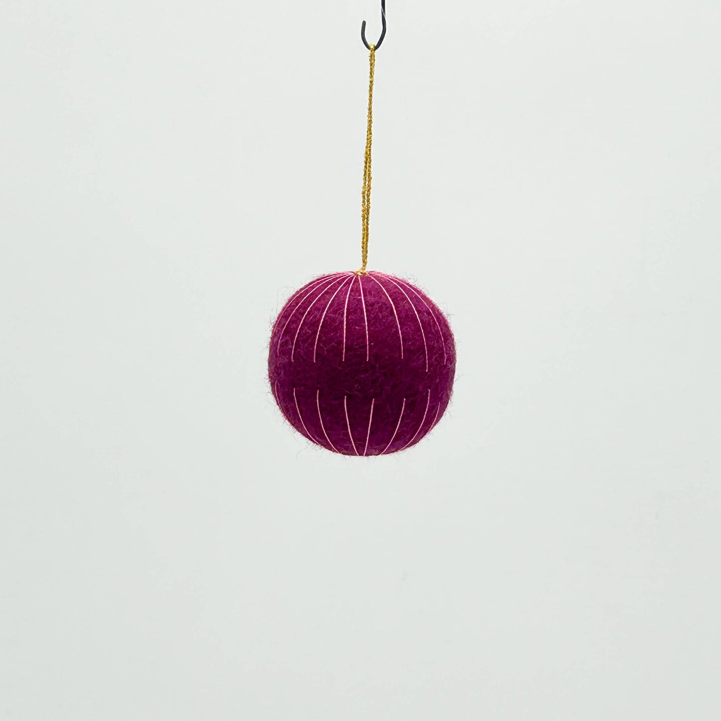 Purple ball with a hook on a white background