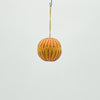 Yellow spherical hanging toy on a white background