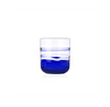 Clear glass with blue liquid on a white background