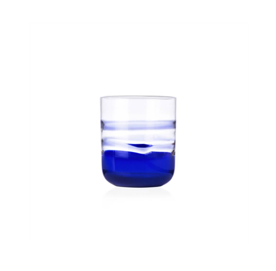 Clear glass with blue liquid on a white background
