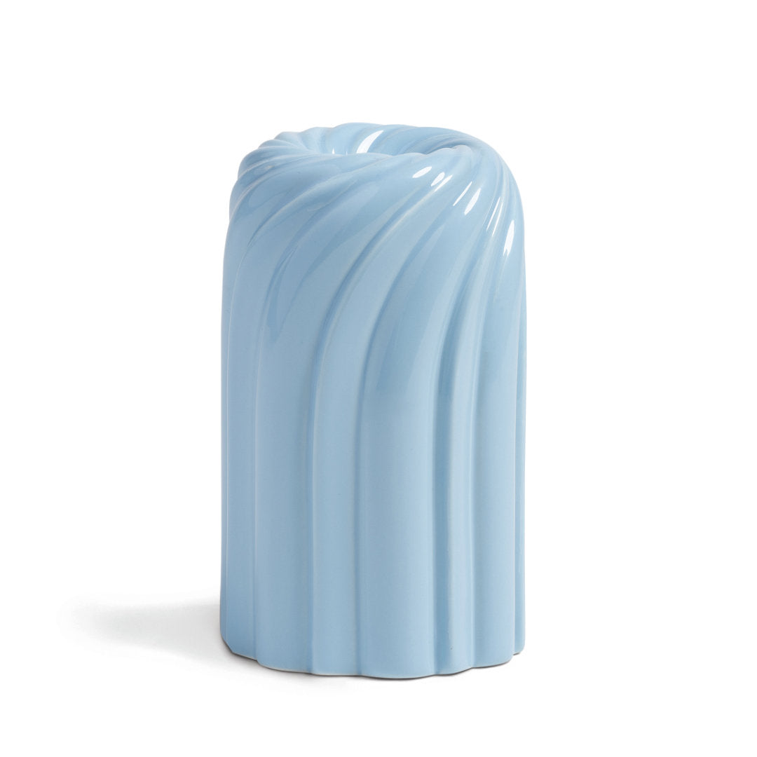 Candle Holder with a swirl design in light blue on a white background