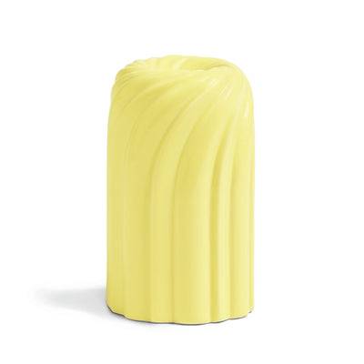 Candle Holder with a swirl design in a bright lemony yellow shade on a white background