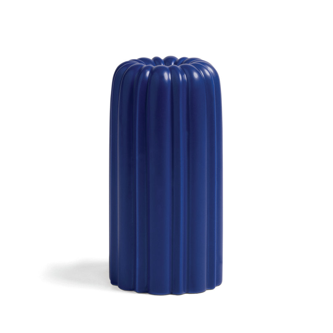 candle holder "cake" with a stripe pattern shape inspired by bundting cakes in a royal blue shade on a white background