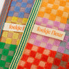 Odds and Ends multi cloth, checkered check design in primary and bright colours by Foekje Fleur, limited Edition with a striped edge