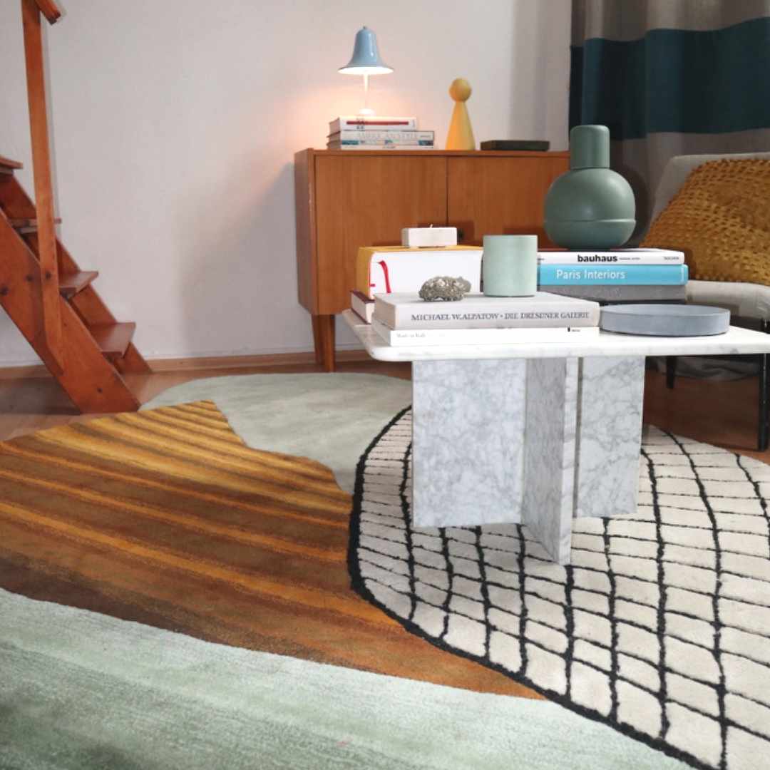 Take the Grip - Captivating Tufted Wool Carpet by Trine Krüger | Gradient Mint to Green with Striking Orange Hues | Black and White Grid Pattern | Non-Rectangular Organic Shape | Iconic Modern Art for Contemporary Living Spaces