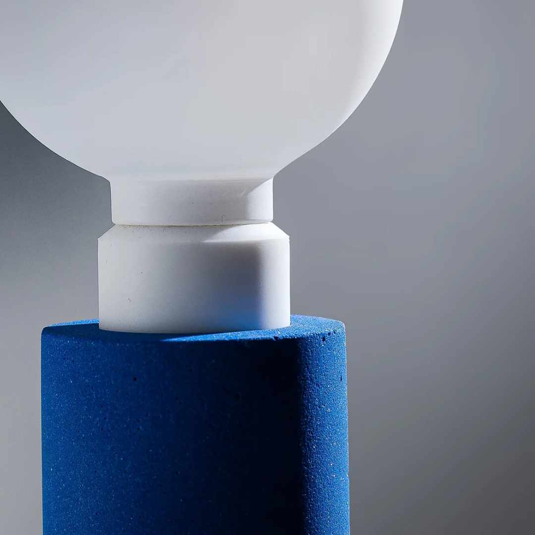 close up image of Swap it lamp with blue marble dust base without lampshade, neon yellow textile cable designed by Moodlight Studio and made in France