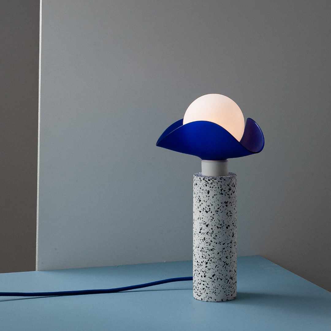 Swap it lamp with black and white charcoal base with small blue lampshade, designed by Moodlight Studio and made in France
