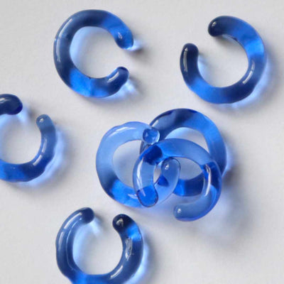 multiple blue glass earcuffs, designed and made by Clara Schweers, glass jewellery